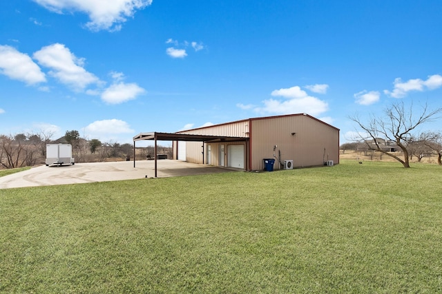 view of yard with a carport and a garage