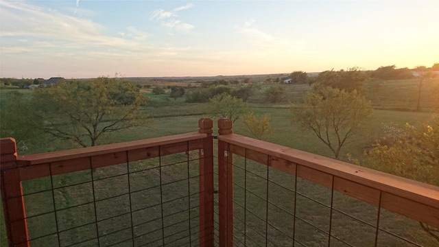 view of balcony at dusk