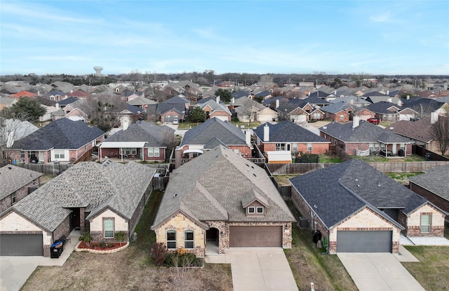 birds eye view of property with a residential view