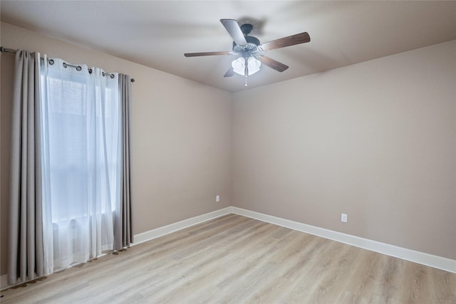 spare room with ceiling fan and light hardwood / wood-style floors