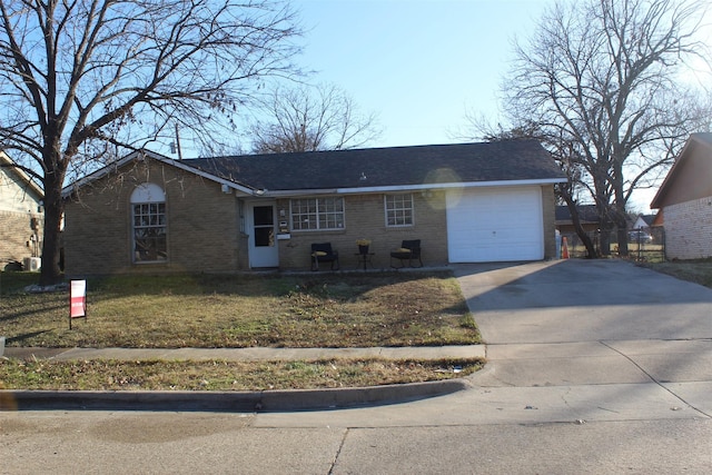 single story home with a front yard and a garage