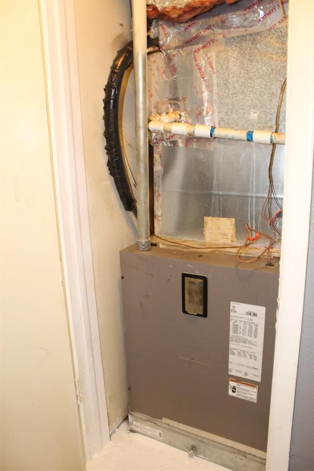 utility room with heating unit