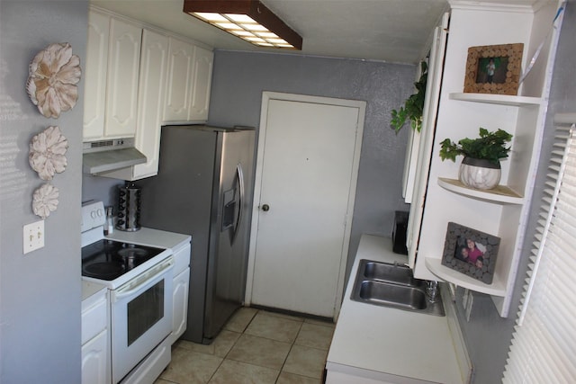 kitchen featuring under cabinet range hood, white electric stove, white cabinets, and light countertops