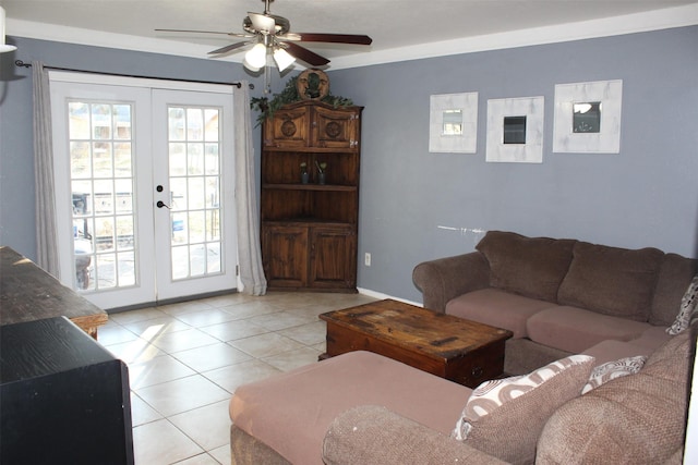 living area featuring light tile patterned floors, french doors, a ceiling fan, and baseboards