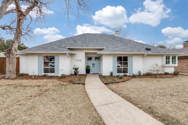 ranch-style house with a front lawn