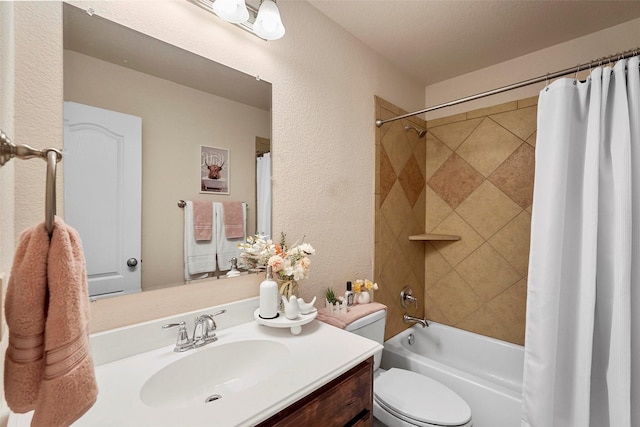 full bathroom with vanity, toilet, and shower / tub combo