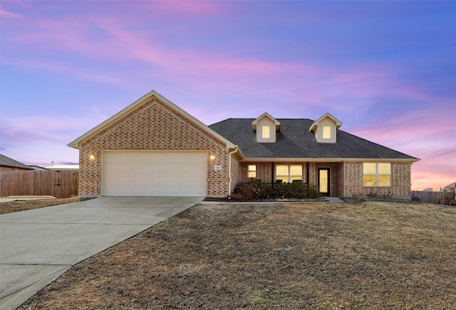 view of front of property with a garage