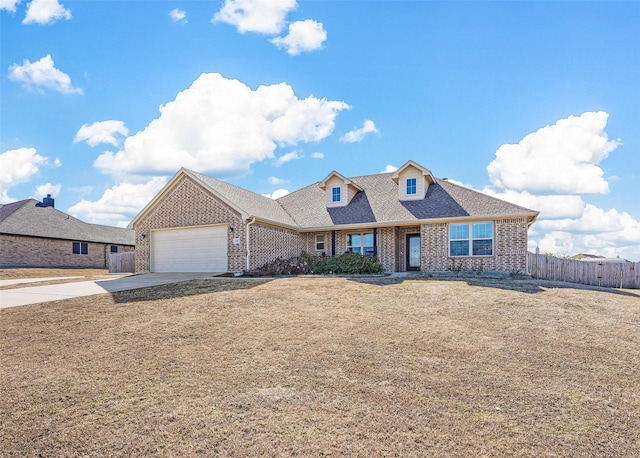 view of front of house featuring a garage and a front yard