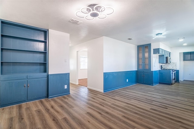 unfurnished living room featuring dark hardwood / wood-style flooring