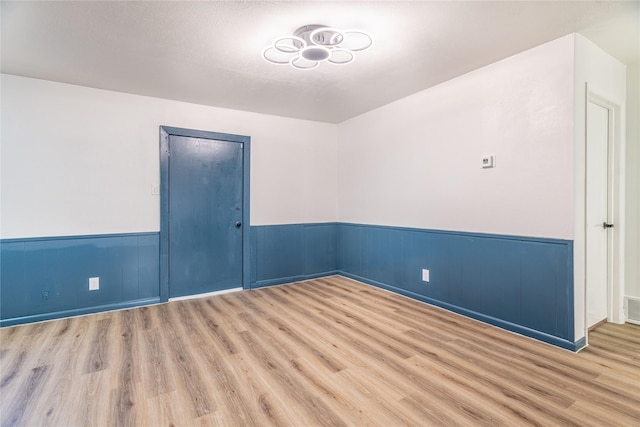 unfurnished room featuring light wood-type flooring