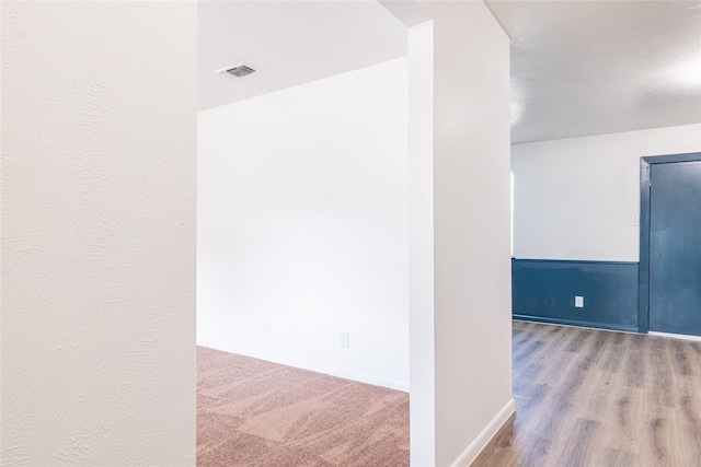 corridor featuring hardwood / wood-style flooring