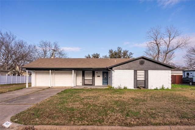 single story home with a garage and a front yard