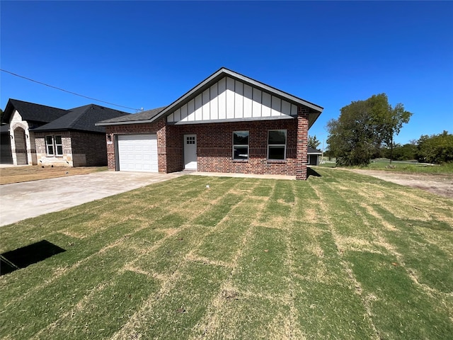 view of front of property with a front lawn and a garage