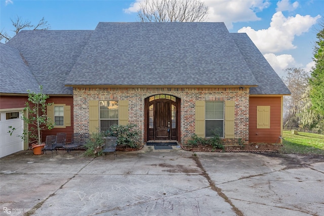 view of front of property with a garage