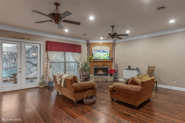 living room with french doors, dark hardwood / wood-style flooring, and crown molding