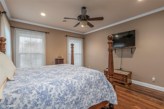 bedroom featuring dark wood-type flooring, ceiling fan, crown molding, and multiple windows