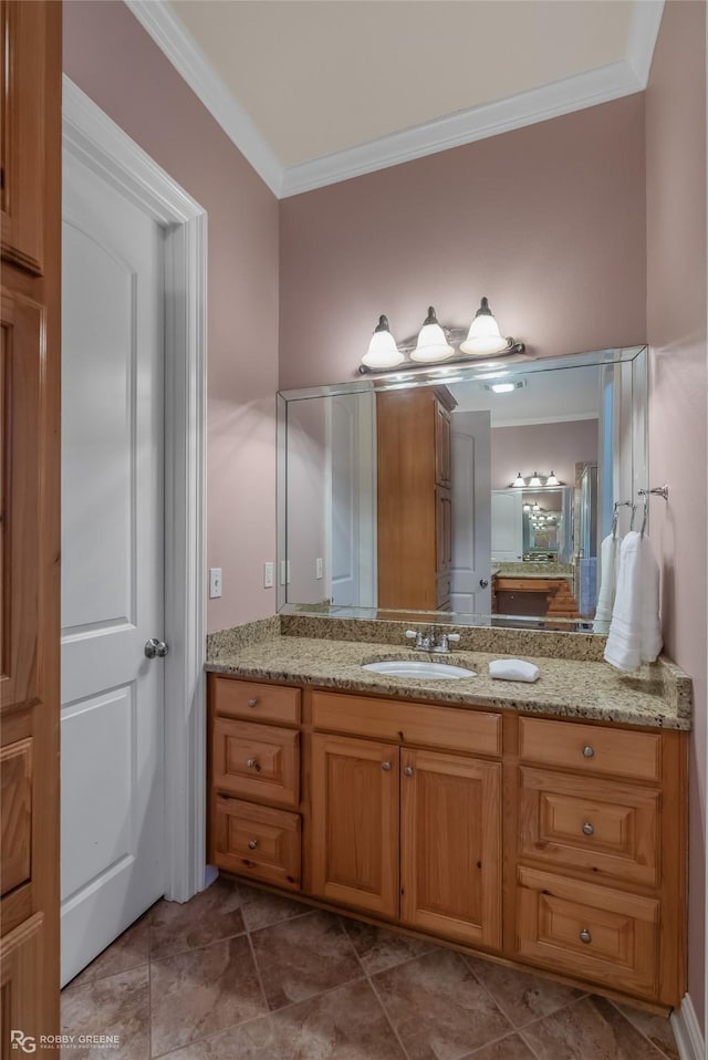 bathroom featuring crown molding and vanity