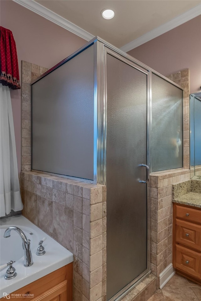 bathroom featuring ornamental molding and independent shower and bath