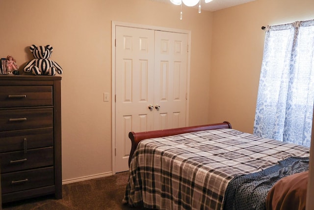 carpeted bedroom featuring a closet