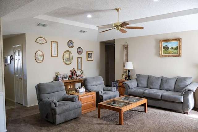 carpeted living room featuring ceiling fan, a textured ceiling, and vaulted ceiling