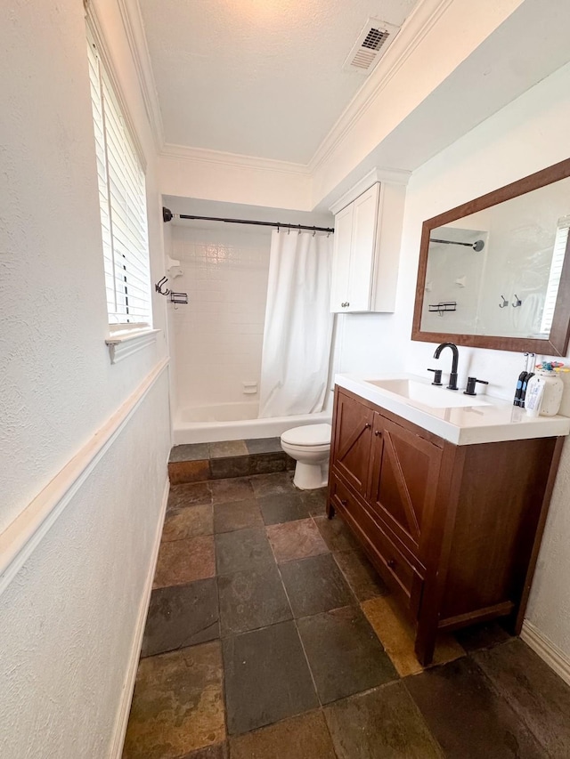 full bathroom featuring toilet, vanity, crown molding, and shower / tub combo with curtain