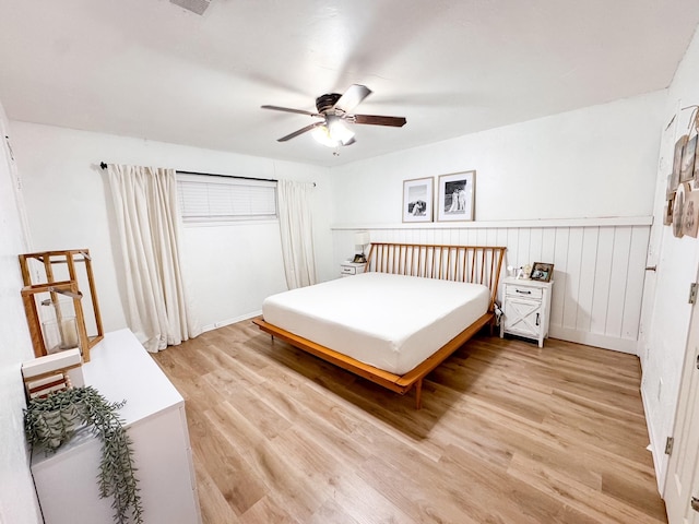 bedroom with light wood-type flooring and ceiling fan