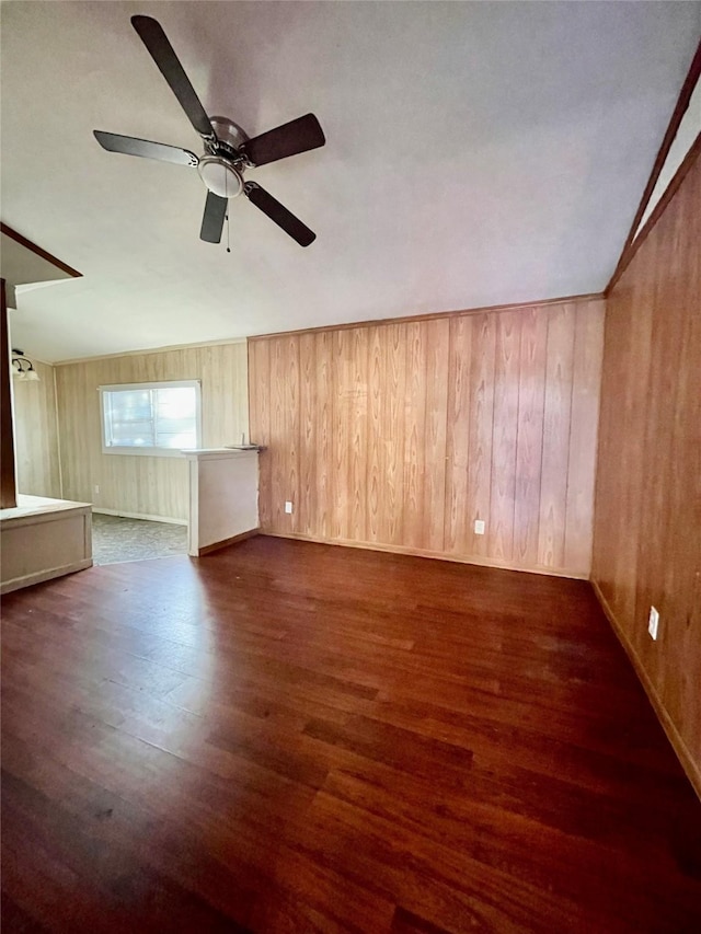 spare room featuring ceiling fan, lofted ceiling, and dark hardwood / wood-style floors