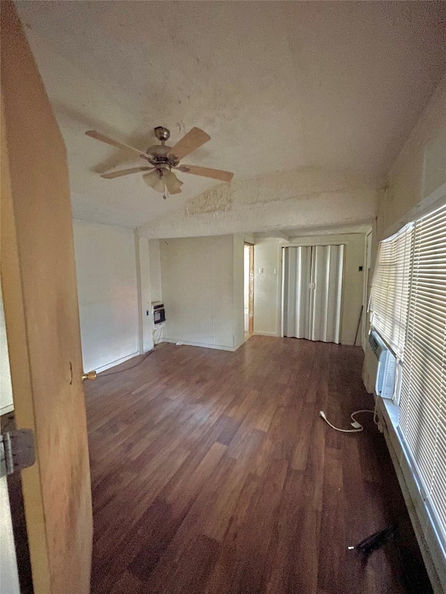 spare room featuring ceiling fan, cooling unit, dark hardwood / wood-style floors, and a textured ceiling