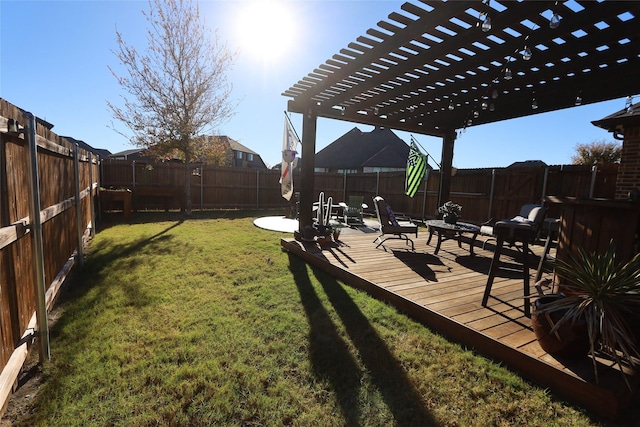 view of yard featuring a wooden deck and a pergola