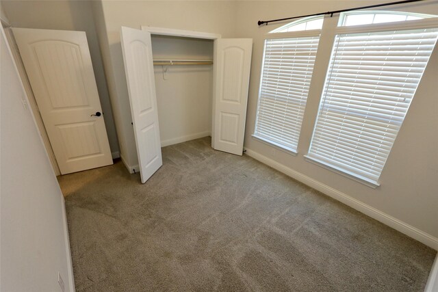 bathroom with double vanity, tile patterned flooring, a sink, and a bath