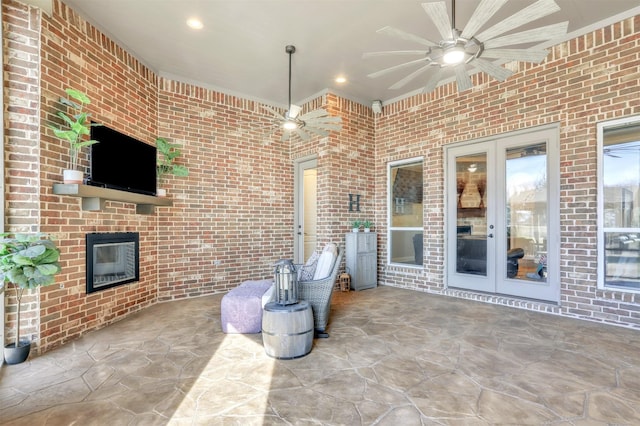 view of patio / terrace featuring ceiling fan and french doors