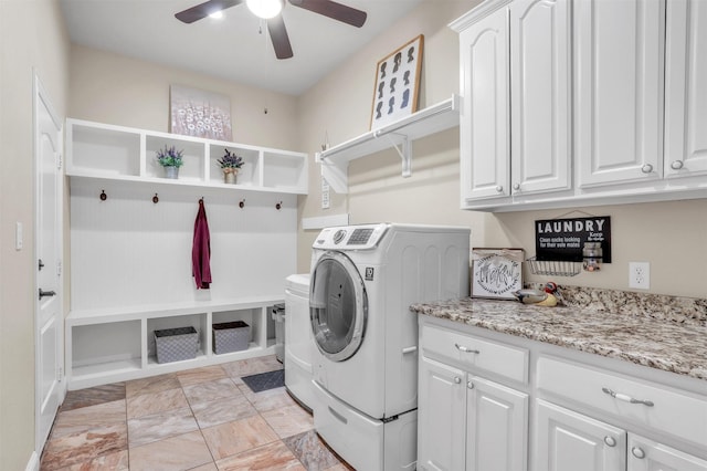 laundry area with ceiling fan, washer and clothes dryer, and cabinets