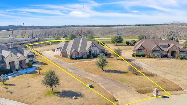 birds eye view of property with a rural view