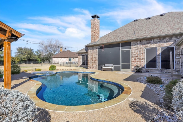 view of pool featuring an in ground hot tub and a patio