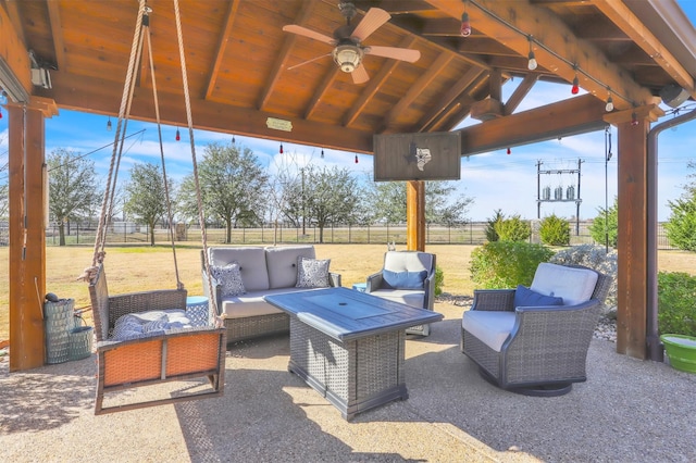 view of patio / terrace featuring ceiling fan, a gazebo, and outdoor lounge area