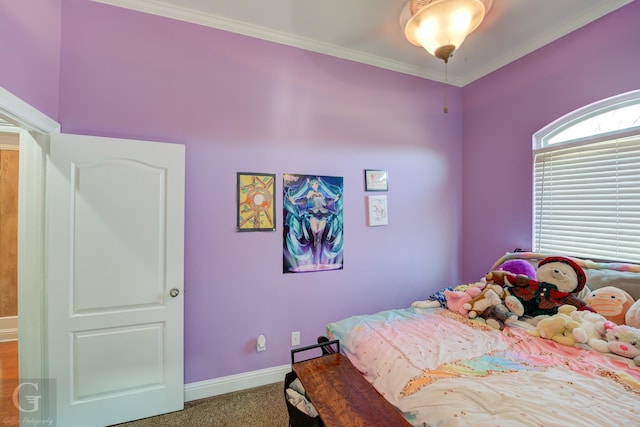 bedroom featuring crown molding and carpet floors