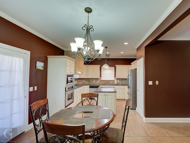 dining space with an inviting chandelier, light tile patterned floors, and crown molding