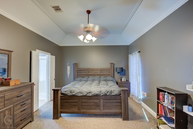 carpeted bedroom featuring a raised ceiling, ornamental molding, and ceiling fan