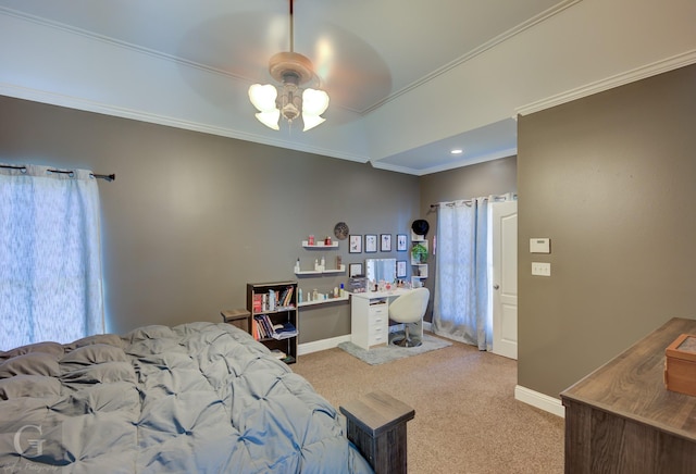 carpeted bedroom featuring ornamental molding and ceiling fan