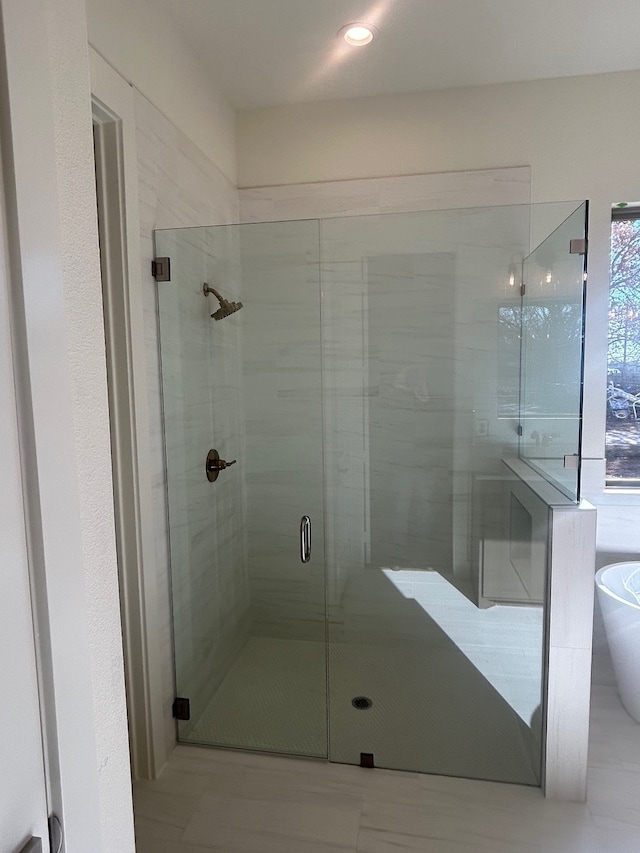 bathroom featuring separate shower and tub and tile patterned flooring