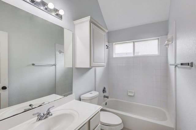 full bathroom featuring lofted ceiling, vanity, bathing tub / shower combination, and toilet