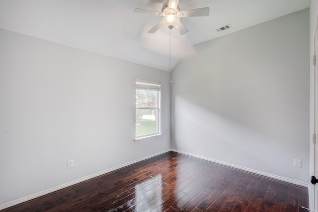 empty room featuring ceiling fan, dark hardwood / wood-style flooring, and lofted ceiling