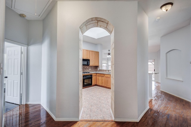 hallway featuring wood-type flooring