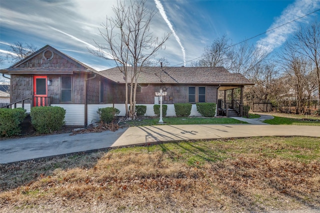 ranch-style house with a front yard