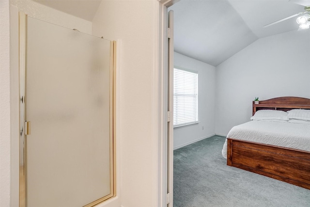 bedroom featuring vaulted ceiling, carpet floors, and ceiling fan