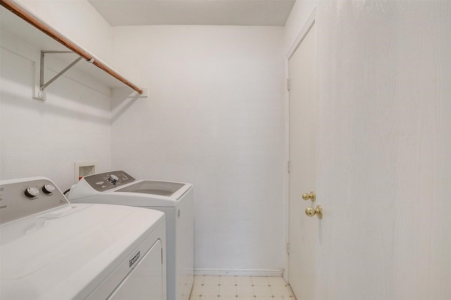 laundry room with independent washer and dryer