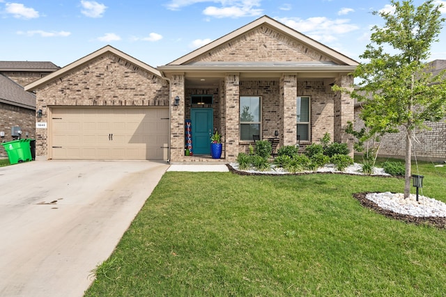 view of front of property with a garage and a front lawn