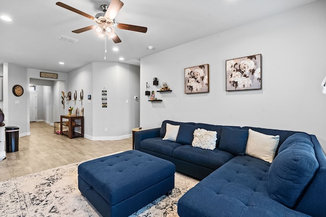 living room with light hardwood / wood-style floors and ceiling fan