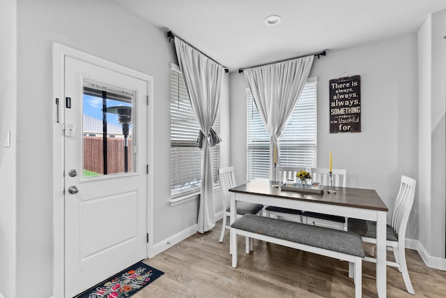 dining space featuring light hardwood / wood-style floors