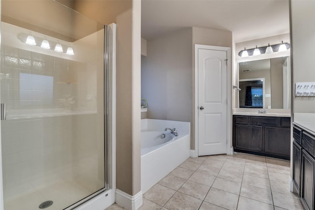 bathroom with tile patterned floors, plus walk in shower, and vanity